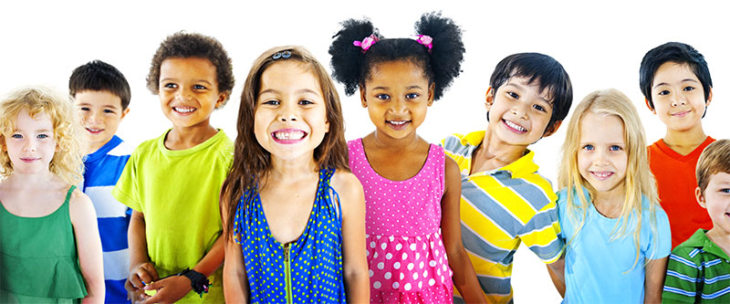 A group of children and adults posing together, with a diverse range of colors in their clothing.